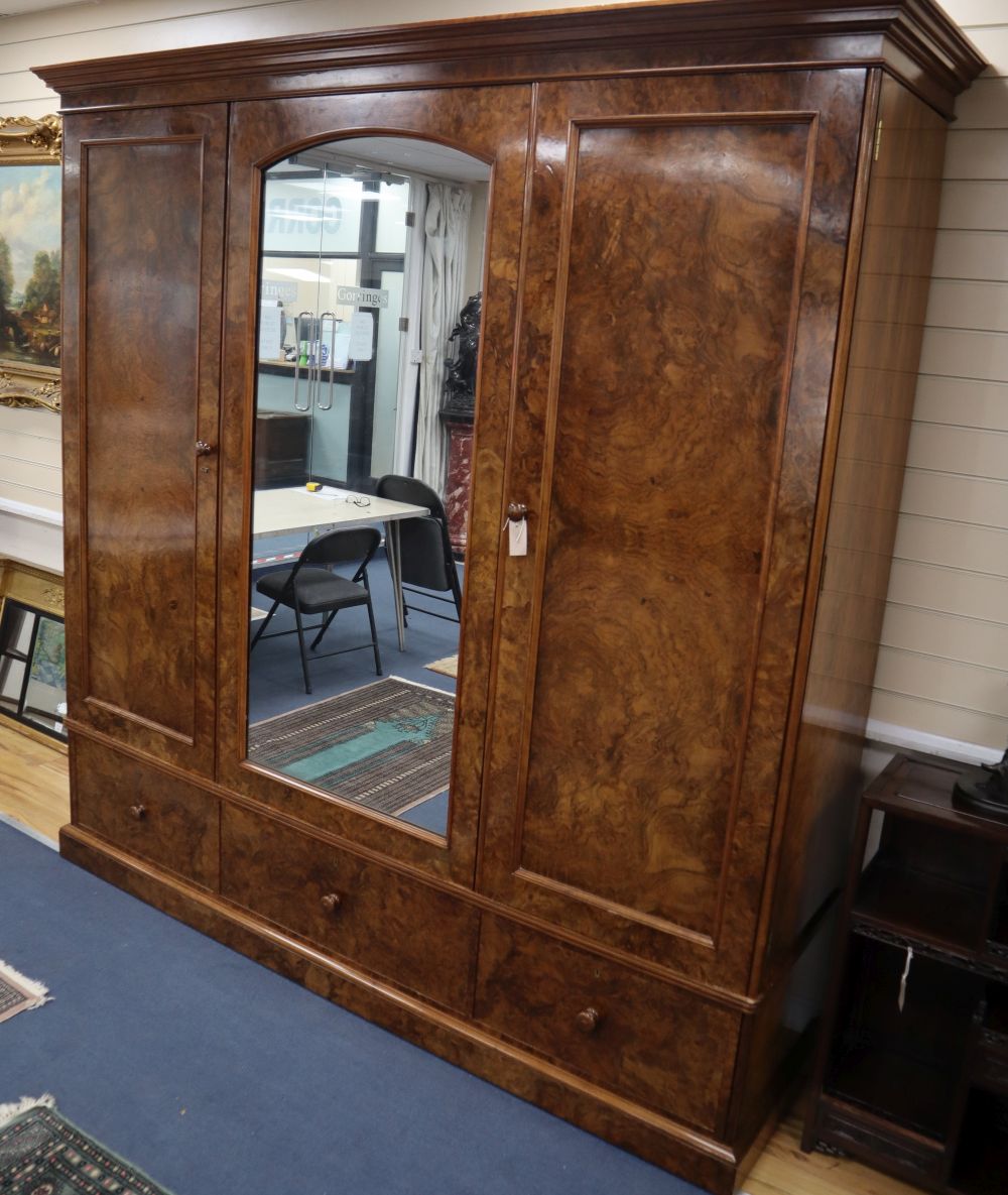 A large Victorian burr walnut triple wardrobe stamped Holland & Sons, W.220cm, D.61cm, H.228cm